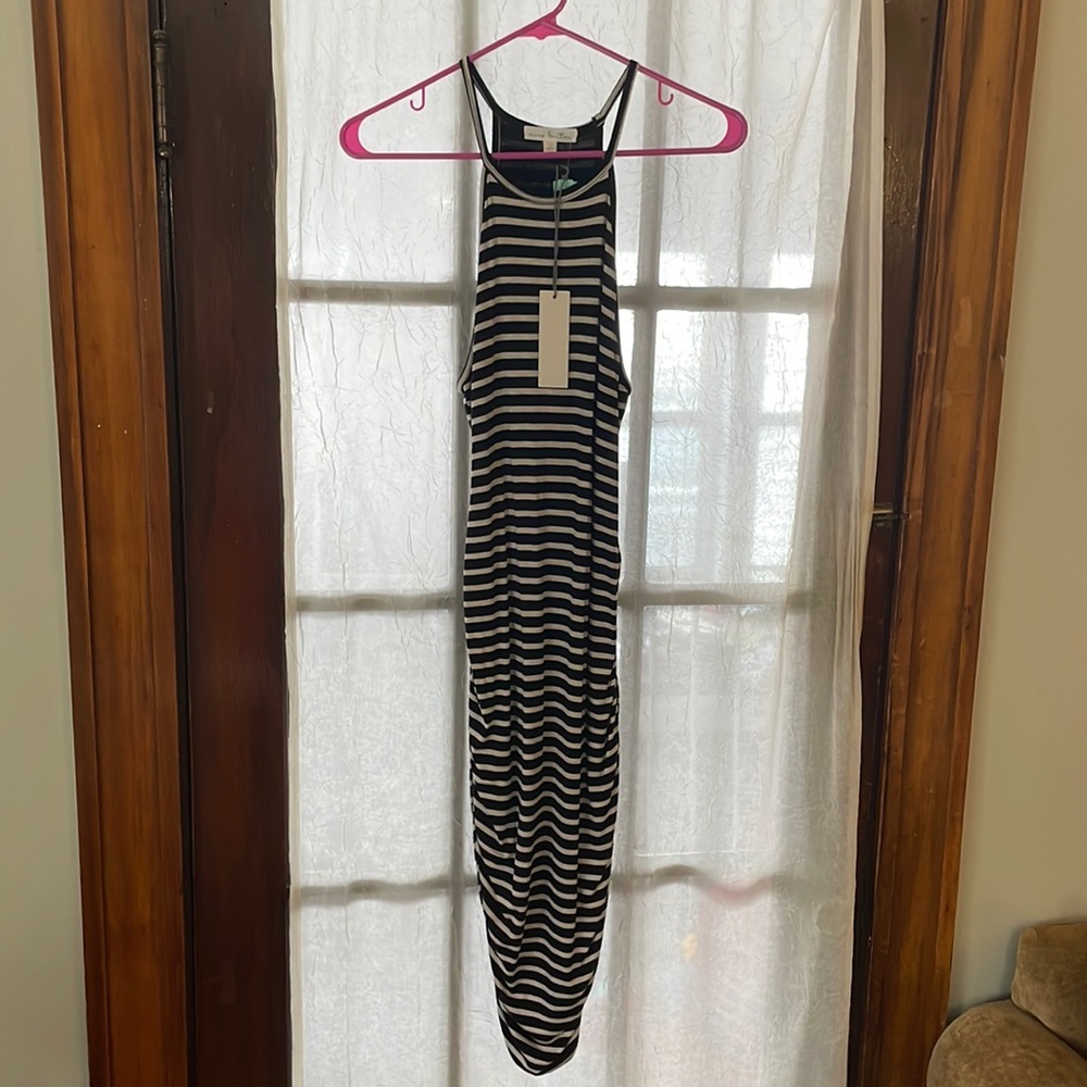 New fitted dress, tags attached. Slightly past knees